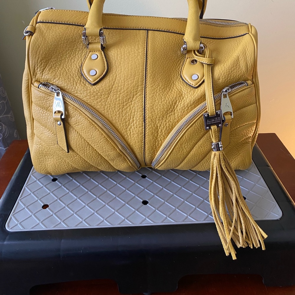 Aimee Kestenberg plethora of pockets on a smooth leather satchel.